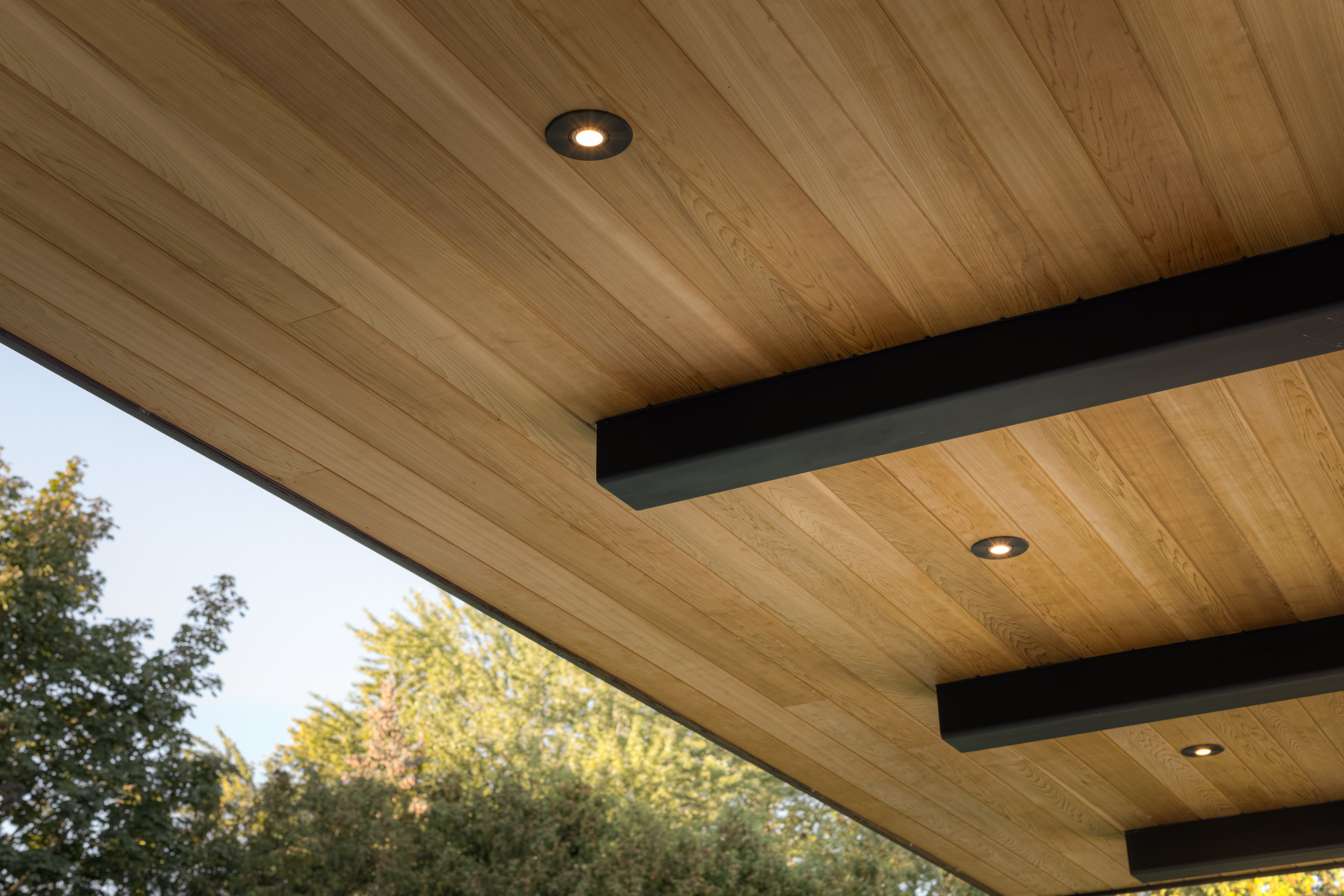 Detail view of wood ceiling with recessed lighting. 