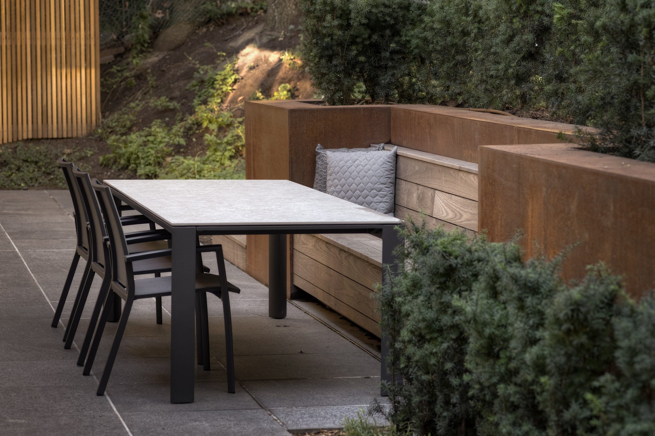 Detail of integrated outdoor seating area with table and chairs. 