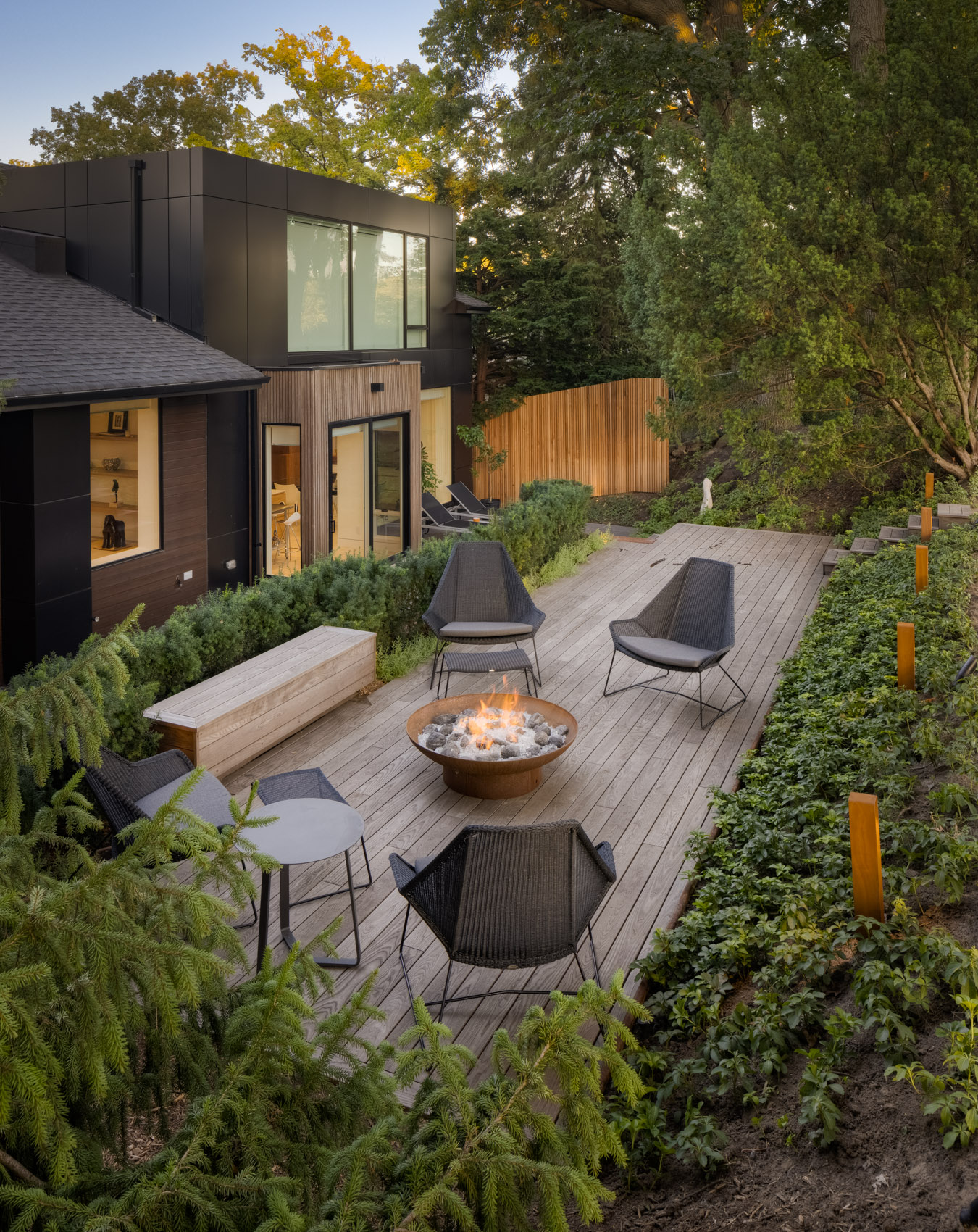 high view of modern patio with fire table and seating