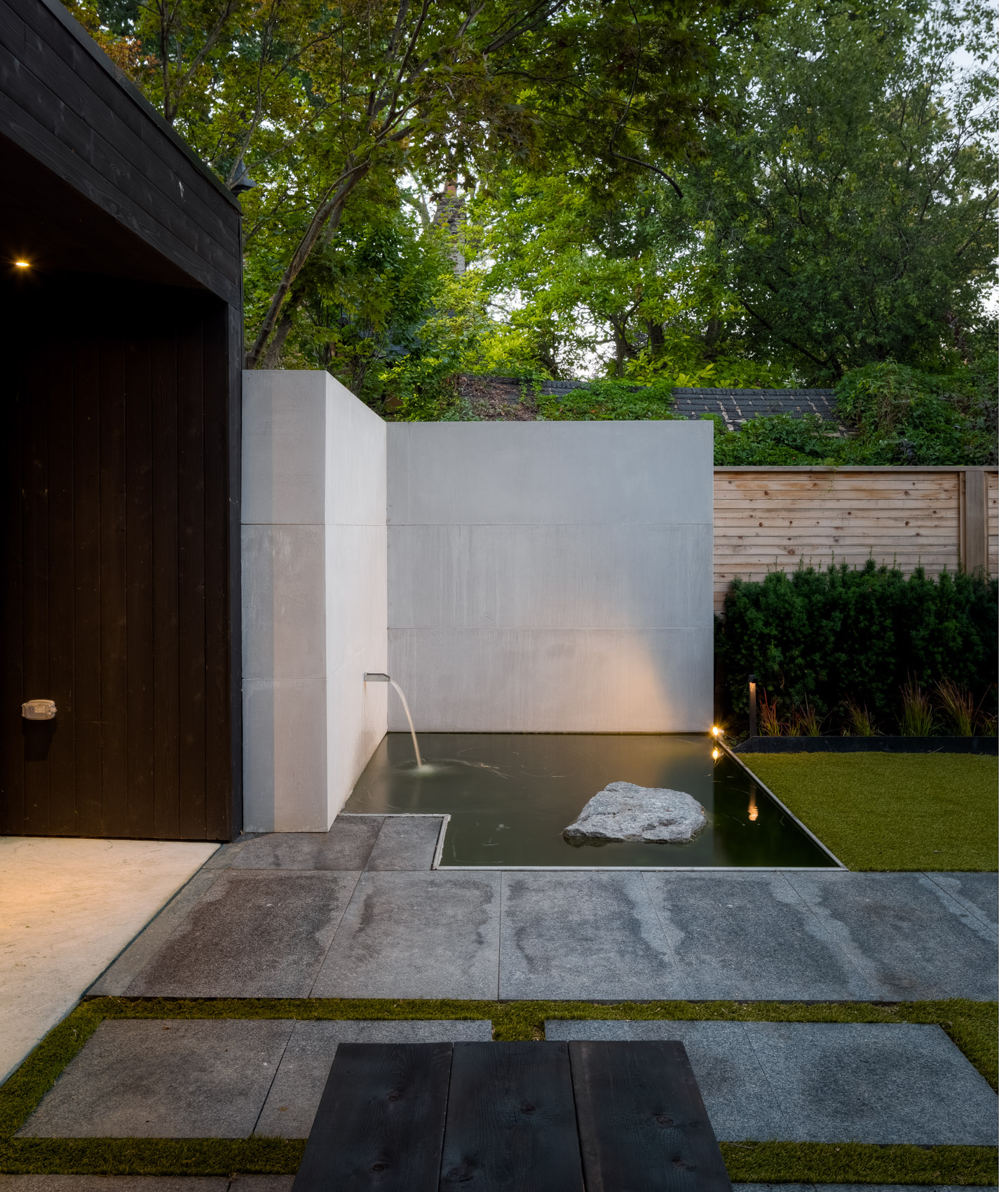 Zen wall with water feature and path. 